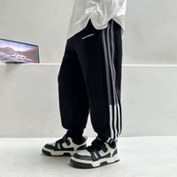 东方骆驼儿童春秋运动卫裤男童中大童宽松秋季休闲裤男孩运动裤潮 灵犀黑 110 身高90-100cm